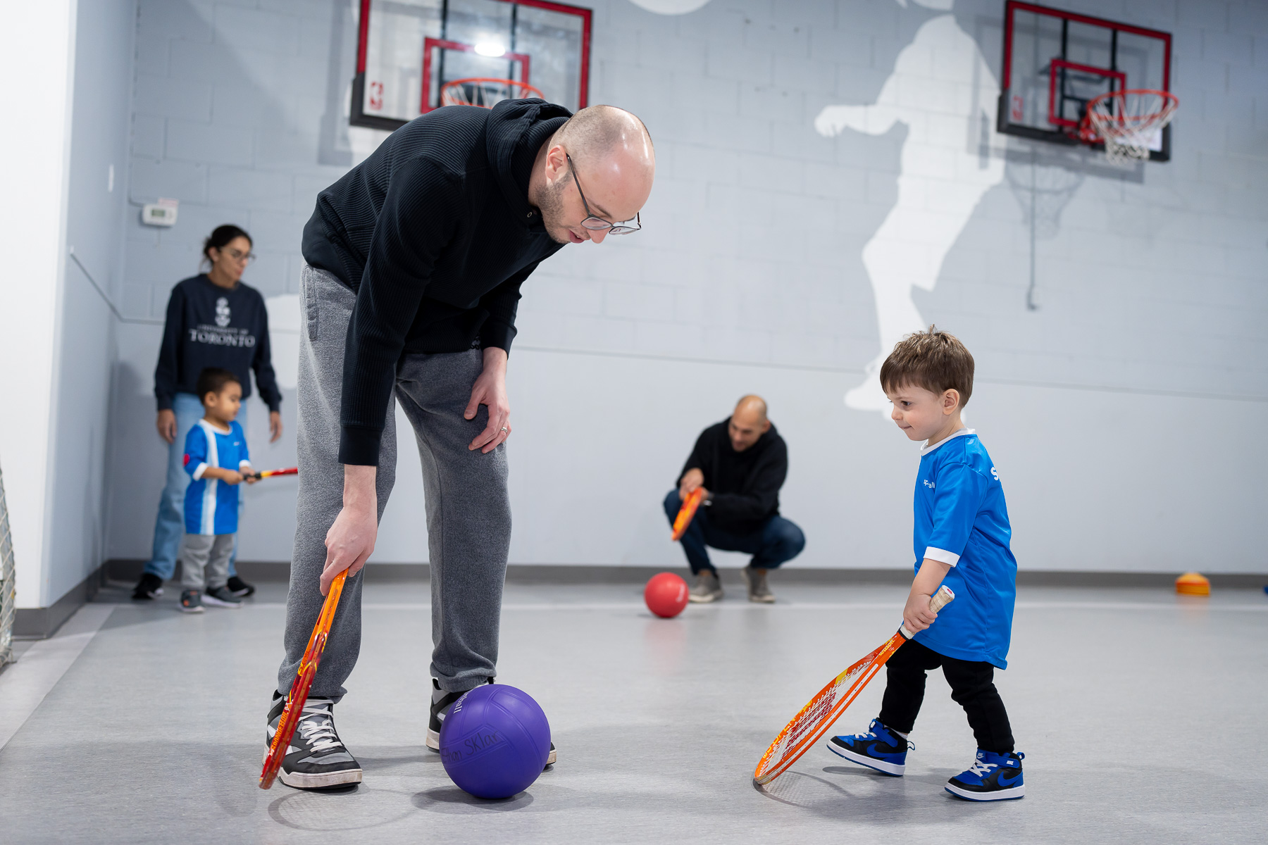 Man and child playing sports